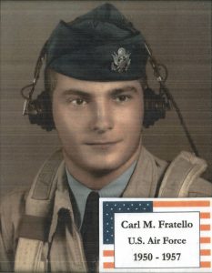 a man in military uniform with a jumpsuit and headphones