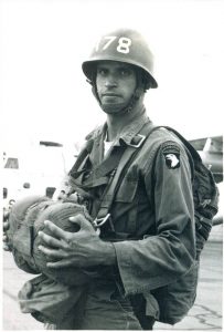 a man in military uniform wearing full military gear