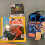 Book on bird watching and binoculars