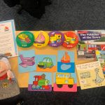 Train conductor puppet and accompanying reading materials