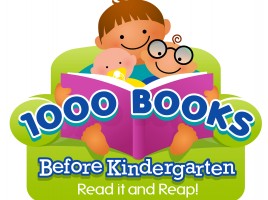 child and toddler holding a book with the words 1000 books before kindergarten