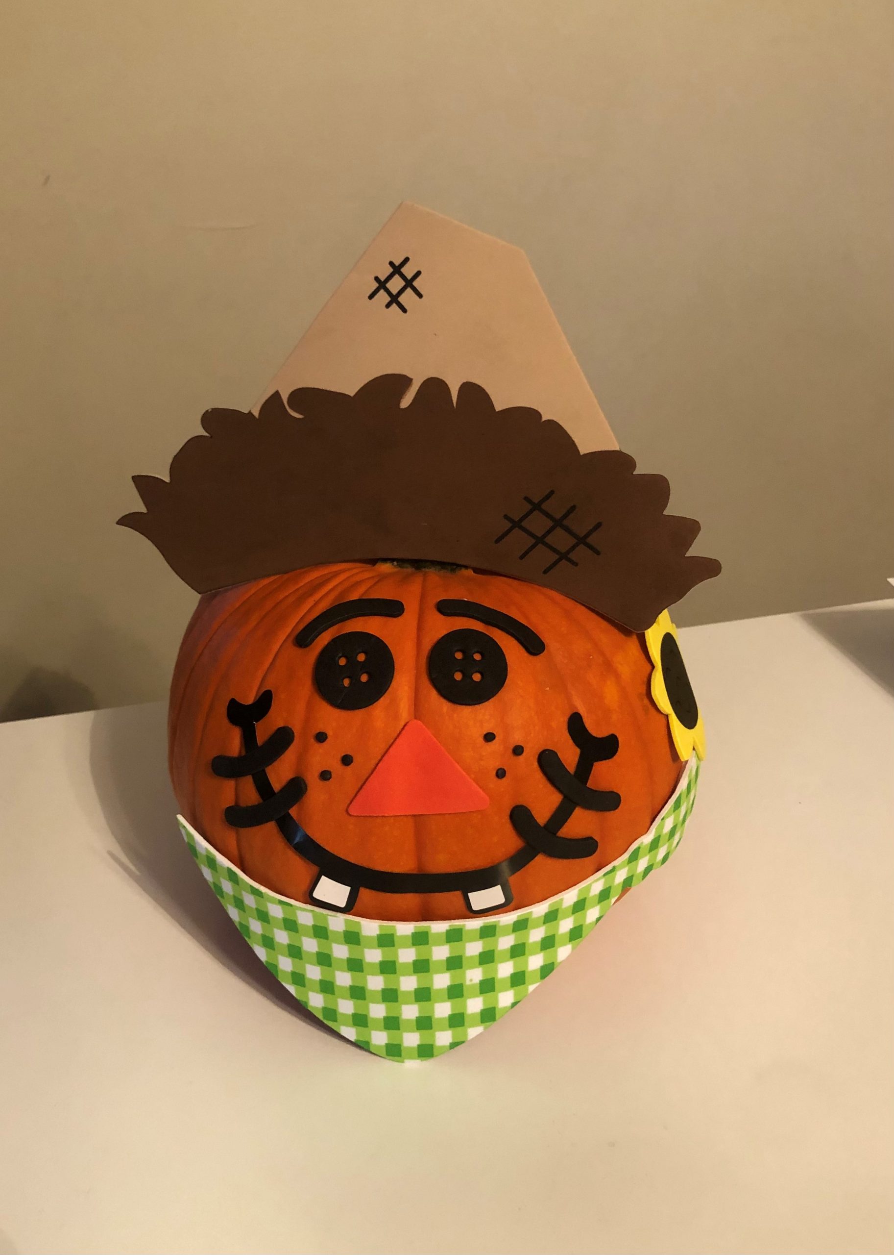 a decorated pumpkin on a table