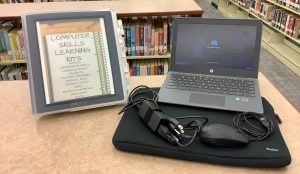 chromebook with binder, mouse, power cable and case