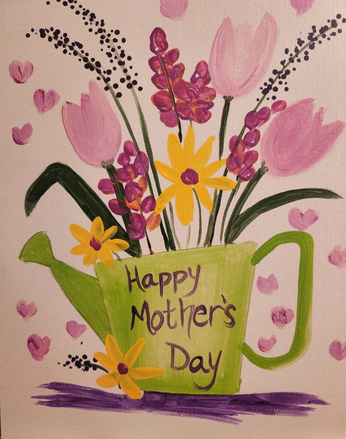 A watering can with flowers in it and "happy mother's day" written on it.