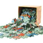 Jigsaw Puzzle Pieces and Box on White Background