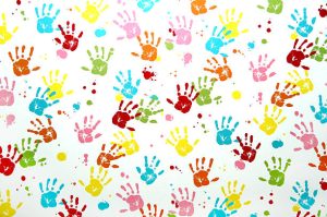 Colorful children hand print on a wall.
