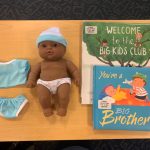 Baby doll, clothes & books