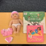 Baby doll, clothes & books