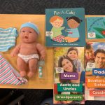 Baby doll, clothes and books