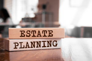 Estate Planning etched into wooden blocks that are sitting on a table.