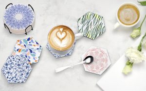 Coasters of different styles and colors on a marble counter.